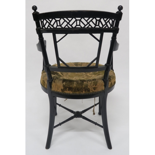 3 - A VICTORIAN EBONISED CHAIR IN THE MANNER OF E.W. GODWINwith foliate upholstered seat, fretwork back ... 