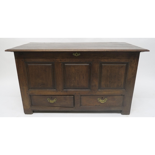 35 - A 18TH CENTURY OAK PANELLED COFFERwith hinged top above two drawers, 81cm high x 141cm wide x 60cm d... 