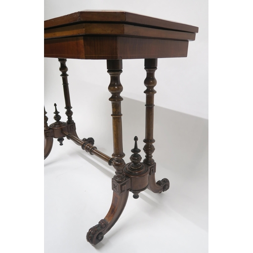4 - A VICTORIAN BURR WALNUT FOLDOVER CARD TABLEwith turned supports and stretcher on shaped out swept fe... 