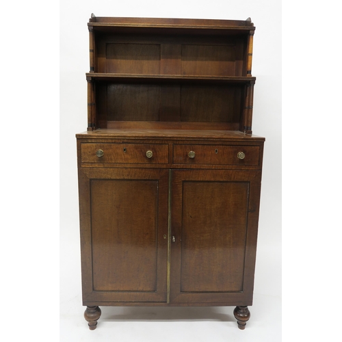 43 - A19TH CENTURY MAHOGANY CABINETwith two open book shelves above two drawers above two panel doors on ... 