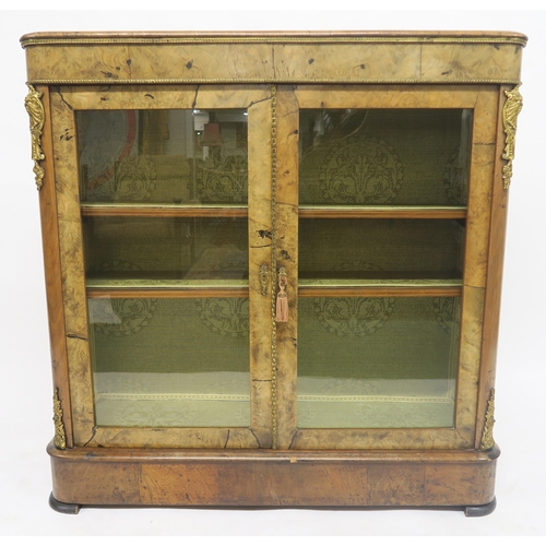 44 - A VICTORIAN BURR WALNUT GLAZED BOOKCASEwith two glazed doors concealing two shelves, brass ormolu mo... 