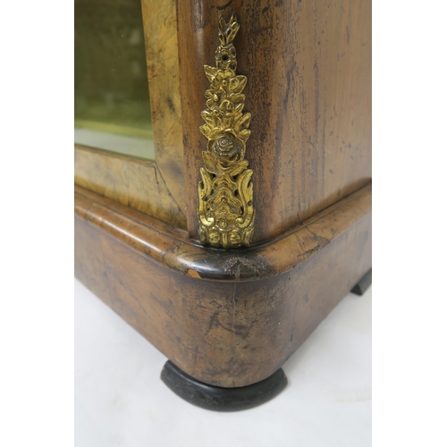 44 - A VICTORIAN BURR WALNUT GLAZED BOOKCASEwith two glazed doors concealing two shelves, brass ormolu mo... 