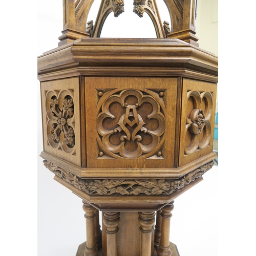 50 - A PUGINESQUE OAK OCTAGONAL BAPTISMAL FONTwith architectural style oak font cover concealing stone ba... 