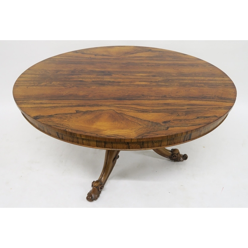 52 - A VICTORIAN ROSEWOOD OVAL TILT TOP BREAKFAST TABLEon a pedestal tripod base with carved scroll feet,... 