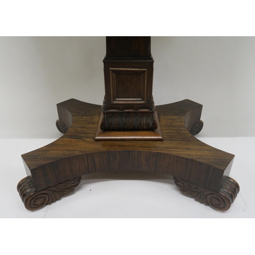 7 - A VICTORIAN ROSEWOOD FOLDOVER TEA TABLEwith central square tapering column support on quatrefoil bas... 
