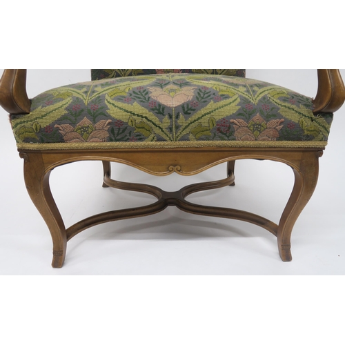 9 - A 19TH CENTURY CONTINENTAL STYLE MAHOGANY FRAMED OPEN ARMCHAIRback and seat upholstered in a William... 