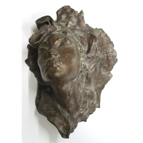 1116 - 20TH CENTURY SCHOOL PROFILE OF A LADYBronze wall mask, indistinctly signed, inscribed, 43 x 31c... 