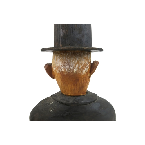 1121 - JOHN BUTLER (BRITISH b.1947)UNDERTAKER (1990)Wood carving, painted and varnished, signed, 60cm high ... 