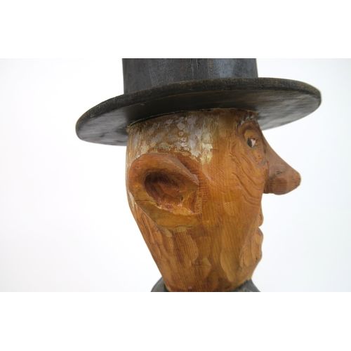 1121 - JOHN BUTLER (BRITISH b.1947)UNDERTAKER (1990)Wood carving, painted and varnished, signed, 60cm high ... 