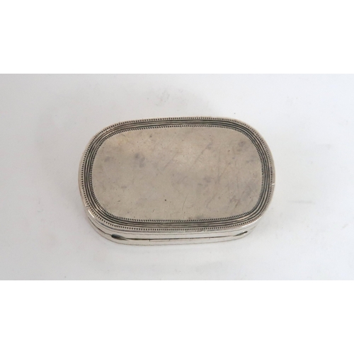 452 - A GEORGE III SILVER VINAIGRETTEof shaped rectangular form, the lid with bright cut border and a cent... 