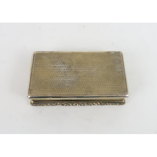 453 - A GEORGIAN SILVER GILT SNUFF BOXof rectangular form, the cover with a relief fox hunting scene surro... 