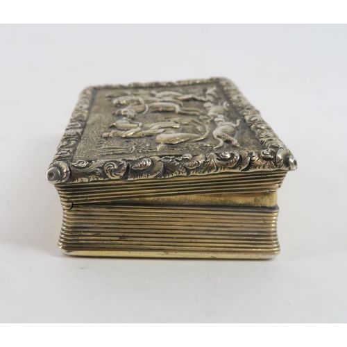 453 - A GEORGIAN SILVER GILT SNUFF BOXof rectangular form, the cover with a relief fox hunting scene surro... 