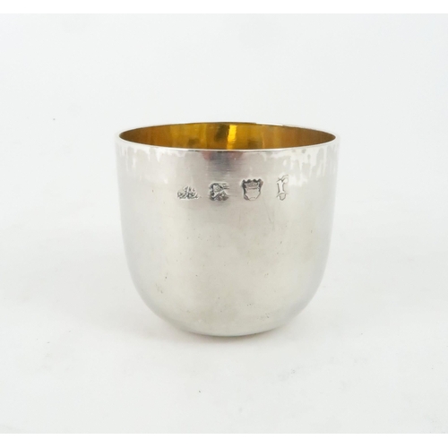 456 - A GEORGE II SILVER TUMBLER CUPof characteristic plain form, with parcel gilt interior, engraved init... 