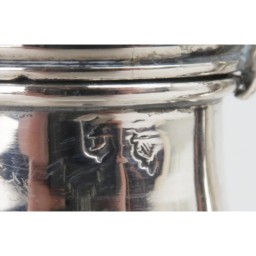 457 - A PAIR OF GEORGE I IRISH SILVER CASTERSof plain baluster form with cross pierced covers and acorn fi... 