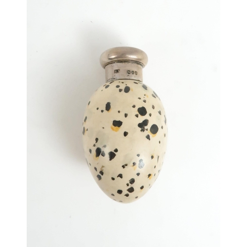 472A - A LATE VICTORIAN SILVER MOUNTED PORCELAIN SCENT BOTTLEin the form of a bird's egg, with printed regi... 