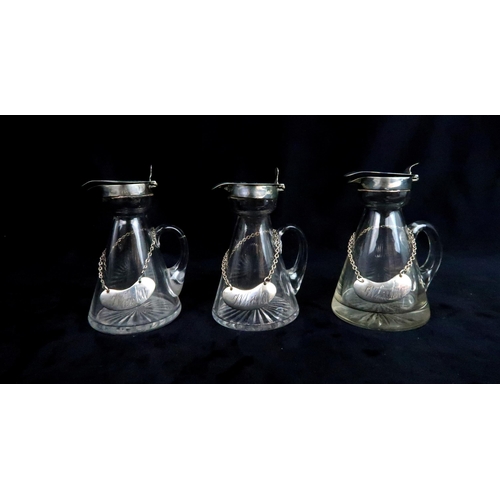 497 - THREE SILVER TOPPED GLASS WHISKY NOGGINSall of conical form, with silver whisky labels, by J & J... 