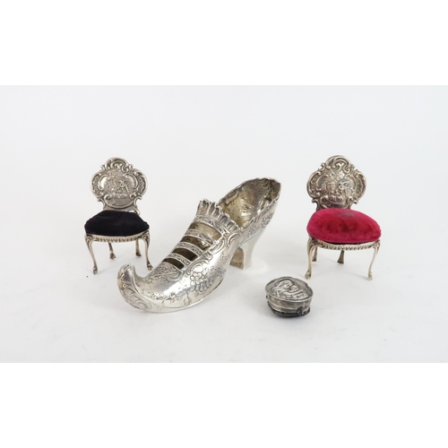 500 - A PAIR OF NOVELTY SILVER PIN CUSHIONSin the form of rococo style chairs, with velvet seats, by Henry... 