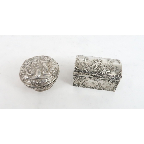 502 - A SCOTTISH SILVER PILL BOXof circular form with repousse decoration of a biblical scene, by Hamilton... 