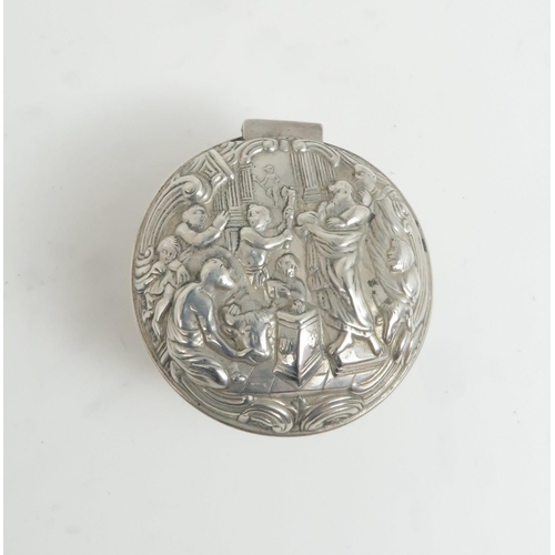 502 - A SCOTTISH SILVER PILL BOXof circular form with repousse decoration of a biblical scene, by Hamilton... 