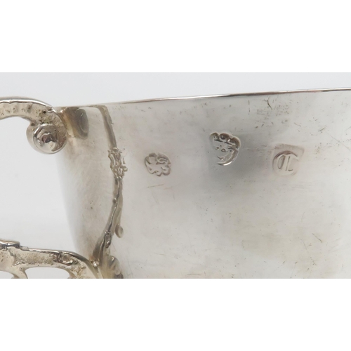 506 - A CHARLES II TWIN HANDLED SILVER PORRINGER the plain form bowl with slightly everted rim and engrave... 