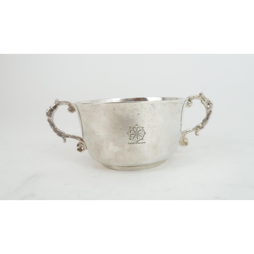 506 - A CHARLES II TWIN HANDLED SILVER PORRINGER the plain form bowl with slightly everted rim and engrave... 