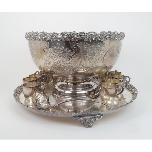 515 - AN IMPRESSIVE SILVER PLATED PUNCH  SETcomprising a footed bowl, twelve cups, a lobed ladle and stand... 