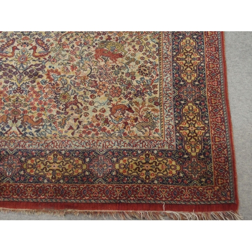 137 - *WITHDRAWN* A CREAM GROUND PERSIAN TEHERAN RUGwith floral all over design featuring stylized big cat... 