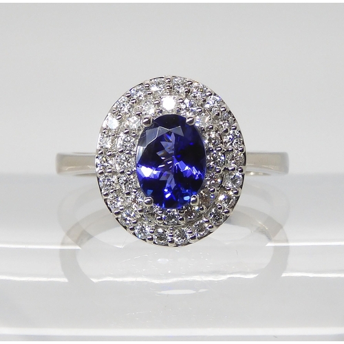 869 - A TANZANITE AND DIAMOND RINGfrom the Rhapsody Collection for The Jewellery Channel. The Central oval... 