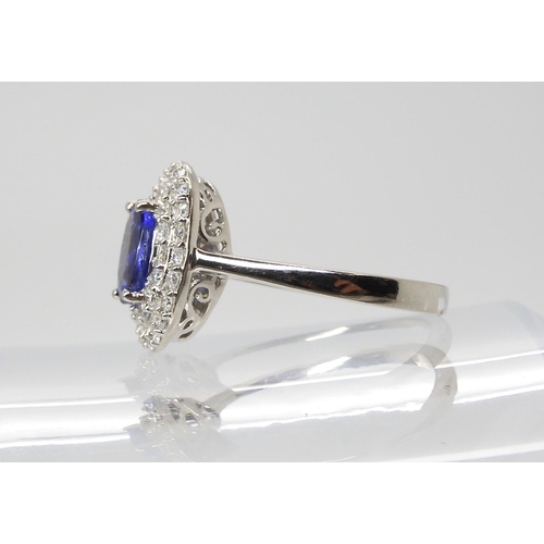 869 - A TANZANITE AND DIAMOND RINGfrom the Rhapsody Collection for The Jewellery Channel. The Central oval... 