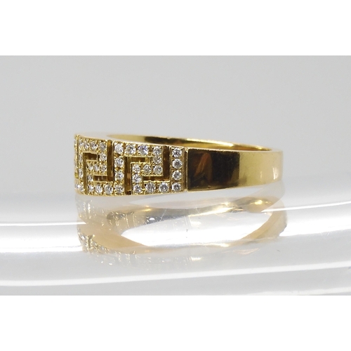 865 - AN 18CT GOLD KEY PATTERN DIAMOND RINGmade by Italian designer Leo Pizzo, finger size P, weight 5.6gm... 