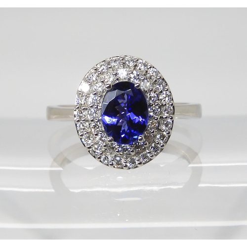 869 - A TANZANITE AND DIAMOND RINGfrom the Rhapsody Collection for The Jewellery Channel. The Central oval... 