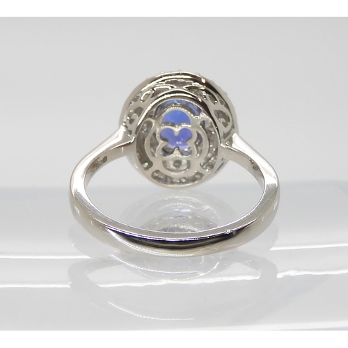 869 - A TANZANITE AND DIAMOND RINGfrom the Rhapsody Collection for The Jewellery Channel. The Central oval... 