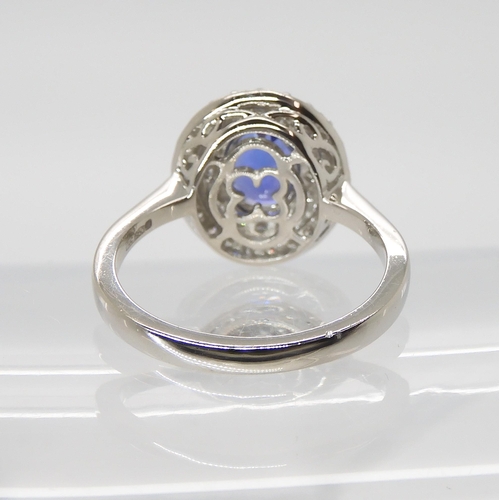 869 - A TANZANITE AND DIAMOND RINGfrom the Rhapsody Collection for The Jewellery Channel. The Central oval... 