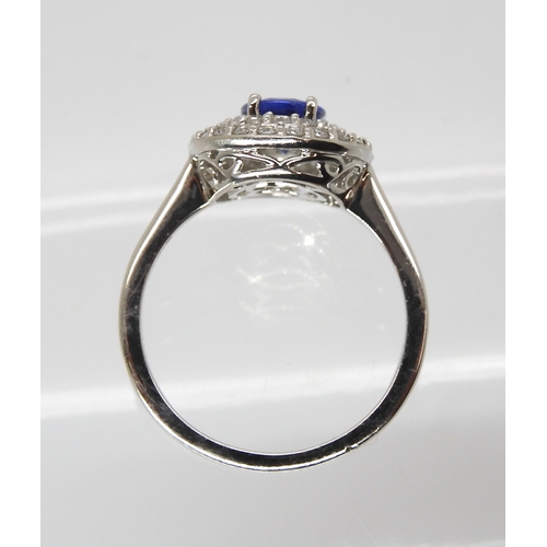 869 - A TANZANITE AND DIAMOND RINGfrom the Rhapsody Collection for The Jewellery Channel. The Central oval... 