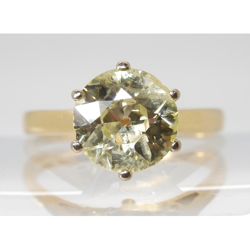 870 - A SUBSTANTIAL YELLOW DIAMOND SOLITAIREin an 18ct gold mount. Approximate dimensions of the diamond 8... 