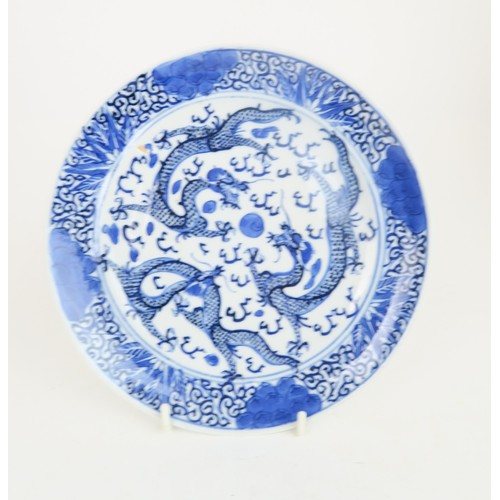 414 - A PAIR OF CHINESE BLUE AND WHITE VASES AND COVERSpainted with fruit and foliage, with shishi finials... 