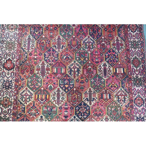 133A - A MULTICOLOURED GROUND BAKHTIARI RUGwith all over geometric lozenge design and a cream geometric mul... 