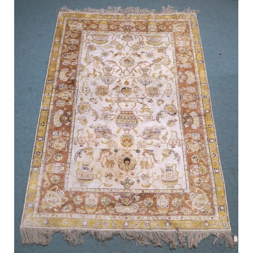 134A - A CREAM GROUND SAVONNERIE RUGwith all over design and yellow borders, 190cm long x 130cm wide... 