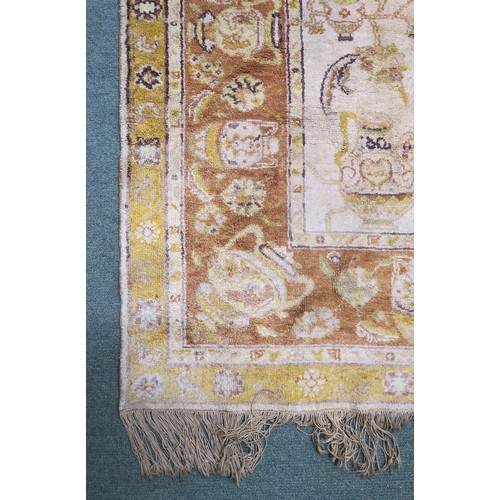 134A - A CREAM GROUND SAVONNERIE RUGwith all over design and yellow borders, 190cm long x 130cm wide... 