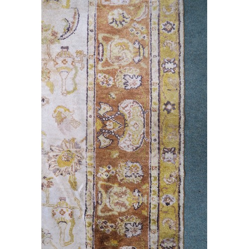 134A - A CREAM GROUND SAVONNERIE RUGwith all over design and yellow borders, 190cm long x 130cm wide... 