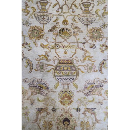 134A - A CREAM GROUND SAVONNERIE RUGwith all over design and yellow borders, 190cm long x 130cm wide... 