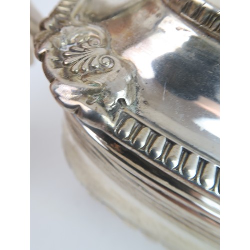 483 - A GEORGE III IRISH SILVER TEAPOTof squat rectangular form, the body fluted with reeded rims, the lid... 