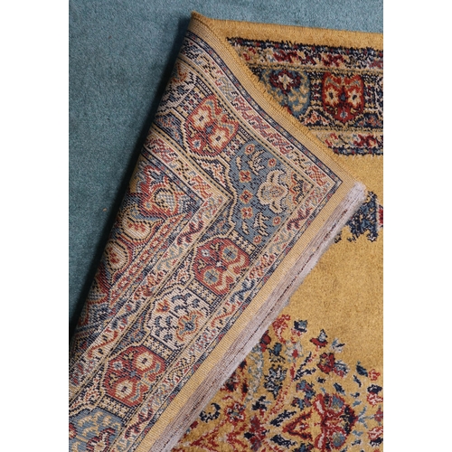 65 - A 20th century yellow ground Kayseri rug with multicoloured border, 200cm long x 134cm wide