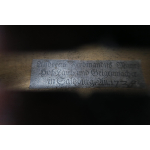 556 - A one piece back violin bearing label to the interior Andreas Ferdinandus mayr/ hof laut und geigenm... 