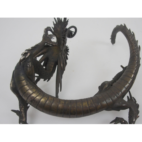 211 - A JAPANESE BRONZE MODELL OF A DRAGON