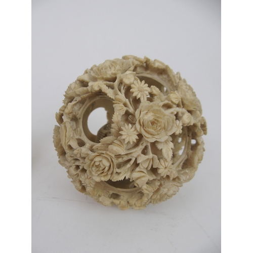 234 - A CHINESE IVORY CONCENTRIC BALL AND A STAND