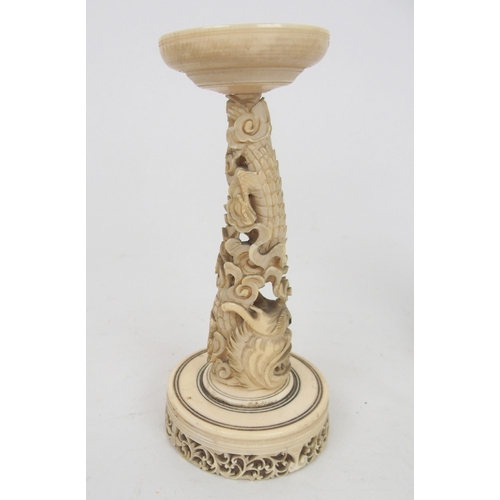 234 - A CHINESE IVORY CONCENTRIC BALL AND A STAND
