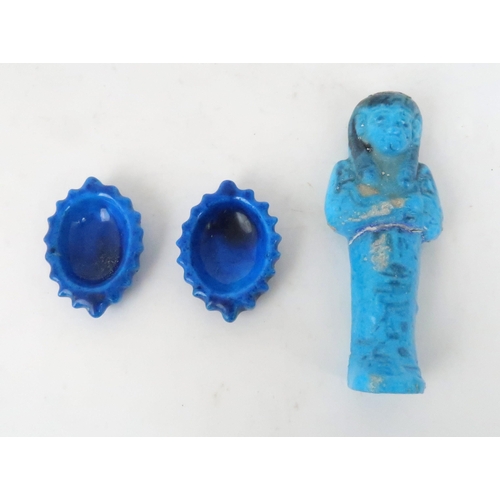 266 - AN EGYPTIAN BLUE GLAZED SHABTI