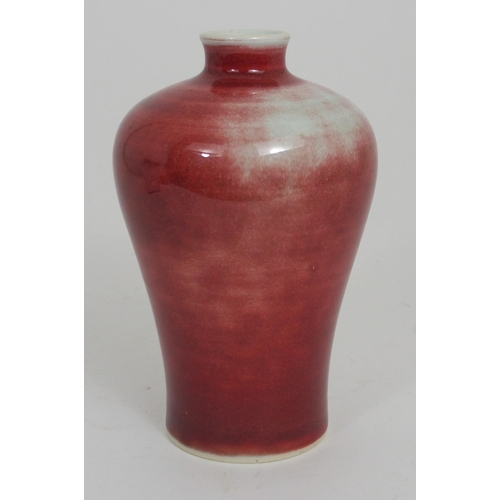 286 - A CHINESE RED GROUND BALUSTER VASE