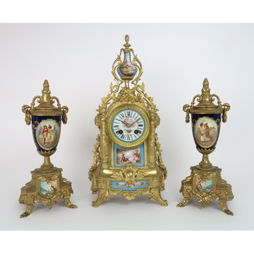 331 - A FRENCH GILT METAL CLOCK GARNITURE WITH S?VRES STYLE PORCELAIN PANELS